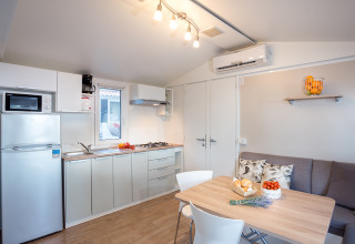 Modern kitchen and dining area at Ježevac Home, Valamar Camping Ježevac, Croatia, with stylish decor.