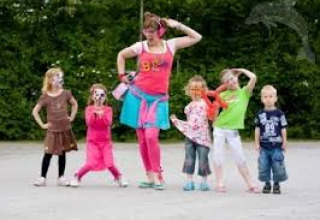 Children dance playfully with an entertainer at ’t Strandheem holiday park in Groningen, Netherlands.