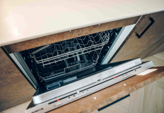 Dishwasher in a tiny house called Tiny Loft with hot tub at Veluwepark de Bosgraaf in the Netherlands.