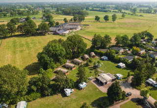 Aerial view of Holiday Resort 't Schuttenbelt in Overijssel, Netherlands showing fields and holiday cabins.
