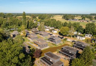 Aerial view of Holiday Resort 't Schuttenbelt in Overijssel, Netherlands, surrounded by trees and fields.