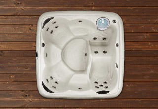 Square jacuzzi on wooden deck at Tiny house XL with jacuzzi and egg barbecue, Holiday park Eigen Wijze, Netherlands.