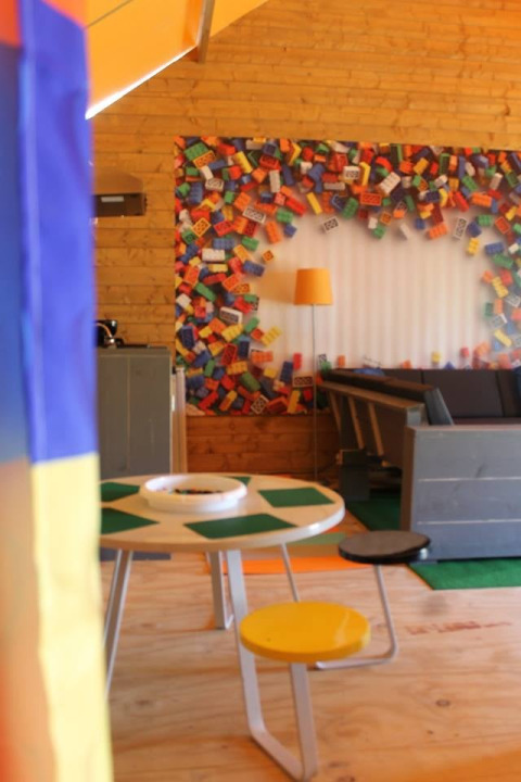 Interior of a safari tent with LEGO theme, colorful bricks and tables, Lego huisje, Beloofde Land, Netherlands.