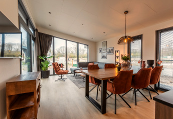 Bright, modern living and dining area at Cube Split Hottub, EuroParcs Enkhuizer Strand, The Netherlands.