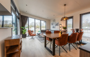 Bright, modern living and dining area at Cube Split Hottub, EuroParcs Enkhuizer Strand, The Netherlands.