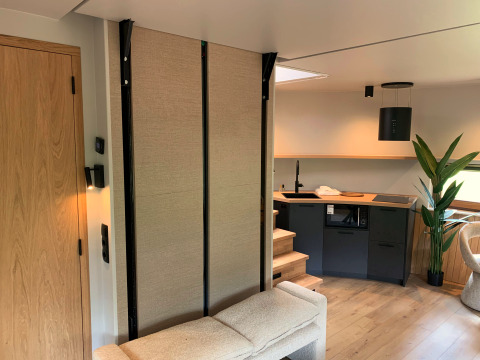 Modern kitchen and living space in The Nutshell tiny house at Recreation Park Den Blanken, Netherlands.