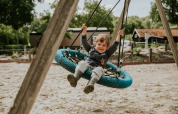 Child on big swing - Camping Si-Es-An - Balkbrug, Overijssel, Netherlands