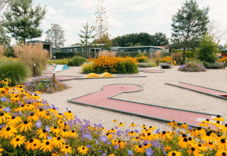Colorful mini golf course with vibrant flowers at Holiday park De Boshoek in Gelderland, Netherlands.