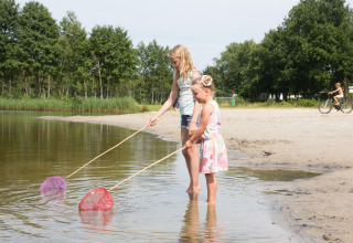 Girls fishing in lake - Camping _t Veld - Rheeze, Overijssel, Netherlands