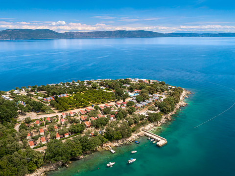 Aerial view of Valamar Camping Marina holiday park in Istria, Croatia, with coastline, cabins, and boats.