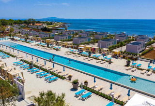 Aerial view of Camping Arena Grand Kažela holiday park in Istria, Croatia, showing pool, cabanas and coastline.