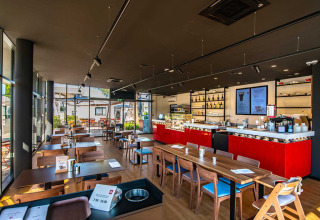 Bright, modern restaurant at Camping Arena Grand Kažela holiday park in Istria, Croatia, with wood decor.
