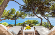 Sun terrace with two loungers, table with lemons, and sea view at Camping Arena Stoja, Croatia.