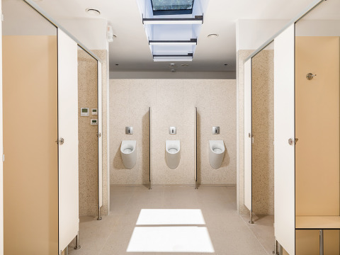 Modern public restroom with urinals and stalls at Camping Arena Stoja holiday park in Istria, Croatia.