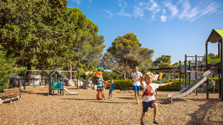 Children enjoying the playground at Valamar Camping Padova holiday park in Primorje-Gorski Kotar, Croatia.