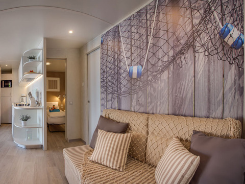 Modern holiday home at Valamar Camping Baška featuring nautical décor and a comfortable lounge area.