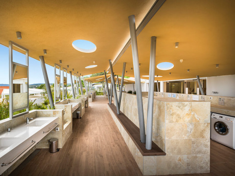Modern communal washbasins and laundry facilities at Valamar Camping Krk in Primorje-Gorski Kotar, Croatia.