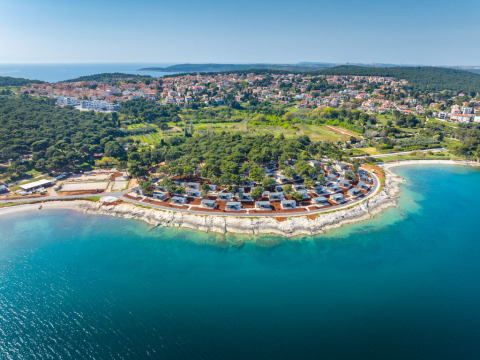Camping Arena Stupice holiday park on the coastline of Istria, Croatia, surrounded by lush forests and sea.