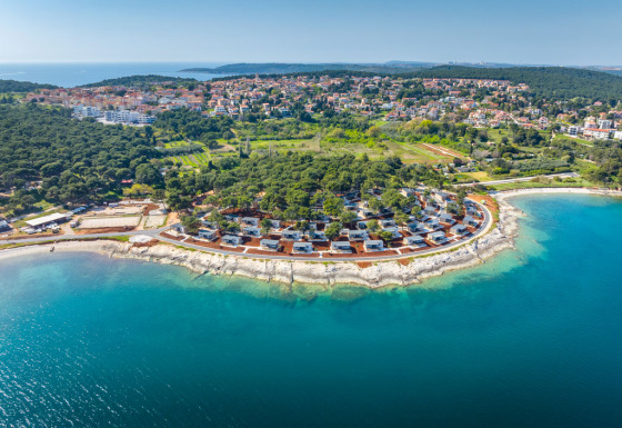 Camping Arena Stupice holiday park on the coastline of Istria, Croatia, surrounded by lush forests and sea.