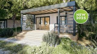 Moderne Camping Home Sea View lodge met houten terras en veel groen, nieuw voor 2025.