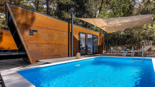 Couple Holiday Home Pool at Camping Porton Nature Hideouts in Croatia, modern lodge with pool view.