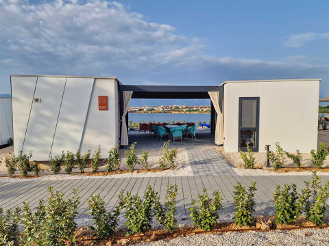 Modern holiday bungalow at Aminess Style Camping Avalona Resort with sea view in Zadar County, Croatia.