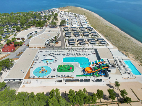Aerial view of Aminess Style Camping Avalona Resort in Zadar, Croatia with pools, waterslides, and seaside lodges.