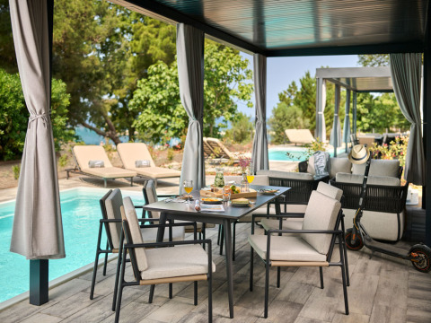 Outdoor dining area by private pool at Amber Sea Luxury Holiday Home, Aminess Style Camping Atea Resort, Croatia.