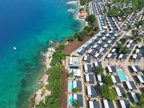 Aerial view of Aminess Style Camping Atea Resort in Primorje-Gorski Kotar County, Croatia, beside clear blue sea.