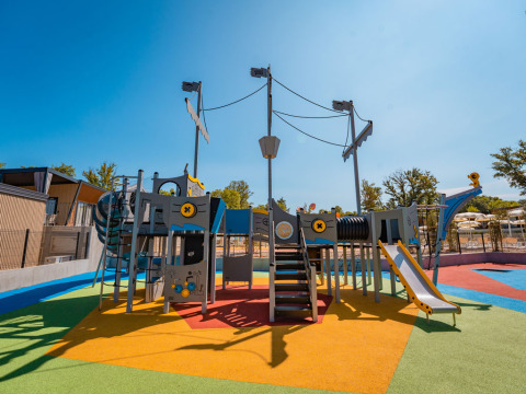 Colorful playground with pirate ship structure at Aminess Style Camping Atea Resort, Primorje-Gorski Kotar, Croatia.