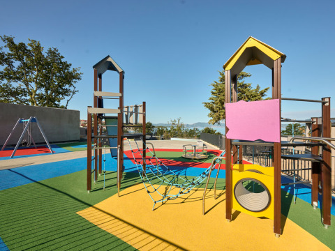 Colorful playground at Aminess Style Camping Atea Resort, Primorje-Gorski Kotar County, Croatia, with views.
