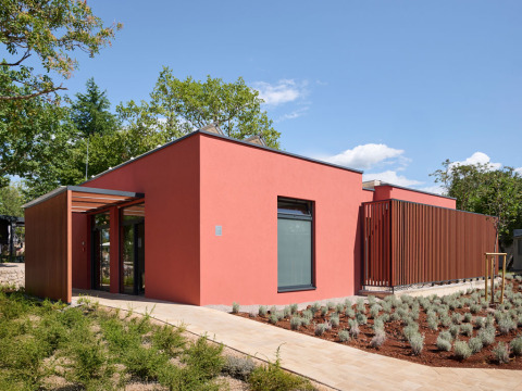 Modern red building with minimalist design at Aminess Style Camping Atea Resort in Primorje-Gorski Kotar, Croatia.