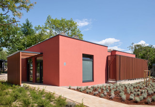 Modern red building with minimalist design at Aminess Style Camping Atea Resort in Primorje-Gorski Kotar, Croatia.
