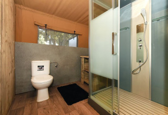 Bathroom in the Two Bedroom Glamping Tent at Camping Arena Stoja, Croatia, featuring shower and toilet.