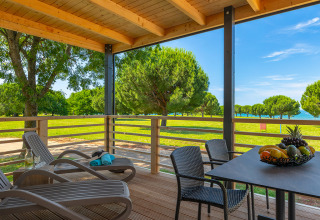 View from Park Riviera Adria Blue Seaside lodge at Camping Park Umag, Croatia, showing terrace and seaside landscape.
