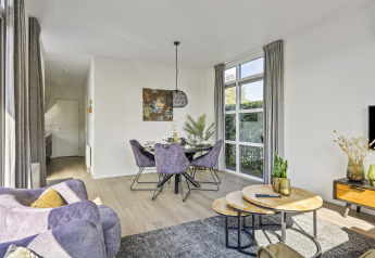 Modern Module Special 4-person lodge at Recreatiepark het Esmeer, bright interior with stylish decor.