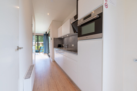 Modern kitchen view in Water Lodge 6 Deluxe with sauna and hot tub at Hofparken Wiltershaar, Netherlands