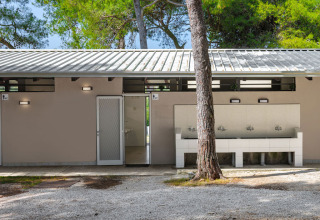 Modern restroom facility with outdoor sinks at Camping Arena Stupice holiday park, Istria, Croatia.