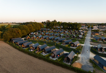 Aerial view of Berg Lodge - Sauna at Resort Mooi Bemelen in the Netherlands, surrounded by greenery.