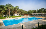 Outdoor swimming pool at a campsite surrounded by forest, Camping GT Keiheuvel, Antwerp, Belgium.