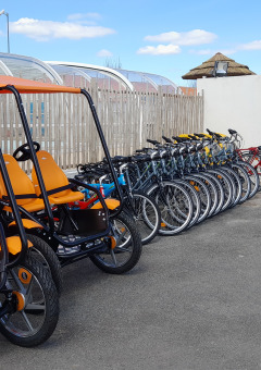 Bike and family quadricycle rental at Flower Camping Le Pré des Sables in Pays de la Loire, France.