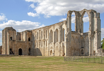 Ruins of an ancient stone church near L'Aiguillon-sur-Mer, Pays de la Loire, under a partly cloudy sky.