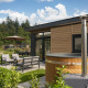 Luxe lodge met hottub en moderne terras bij Veluwepark de Bosgraaf in Nederland, omringd door natuur.