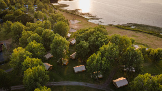 Aerial view of Huttopia Lac d'Aureilhan - Mimizan holiday park nestled by the lake in Nouvelle-Aquitaine, France.