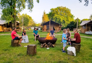 Guests on field by fire bowl - Sandberghe - Uden, Gelderland, Netherlands