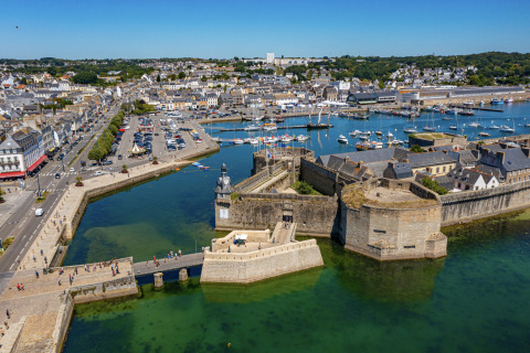 Aerial view of the historic port and fortified old town near Fouesnant, Brittany, France on a sunny day.