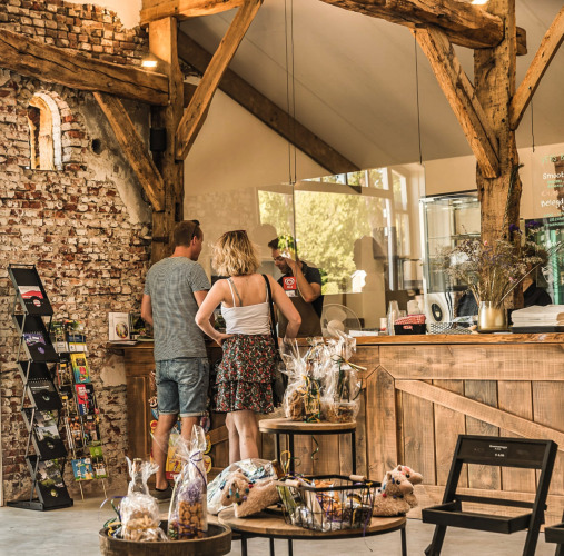 Visitors order at a rustic counter inside Holiday Park Mölke in Overijssel, the Netherlands.