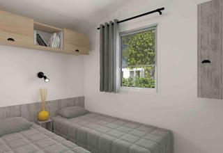 Modern glamping room with two single beds, a window with a green view, and minimal wooden storage units.