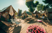 Sunny outdoor deck with tents, umbrellas, flowers, and camping chairs at Sivinos Camping Boutique in Lombardy, Italy.