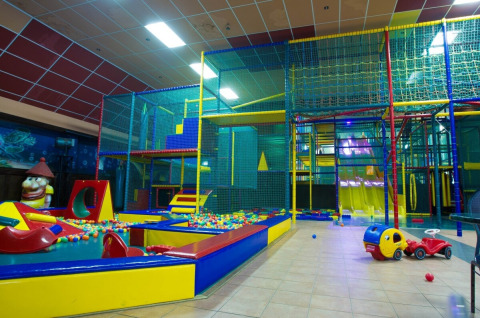 Indoor play area with colorful ball pits, climbing structures and slides at De Scherpenhof, Gelderland.
